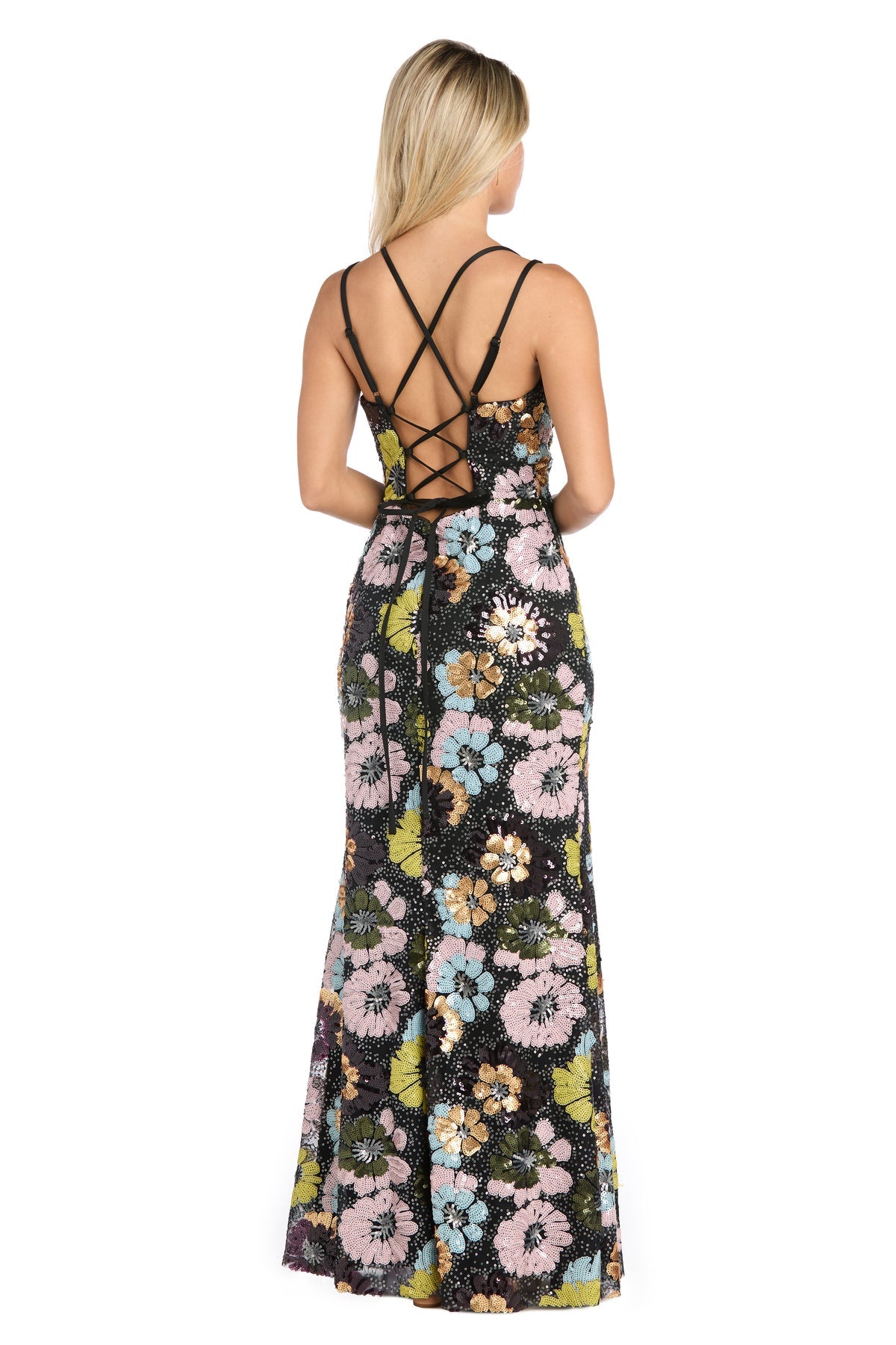 Woman shown from the back wearing the Floral-Sequin Long Black Prom Dress: Morgan 19051, a sleeveless, floor-length gown with multicolored floral sequins and a crisscross lace-up open-back design.